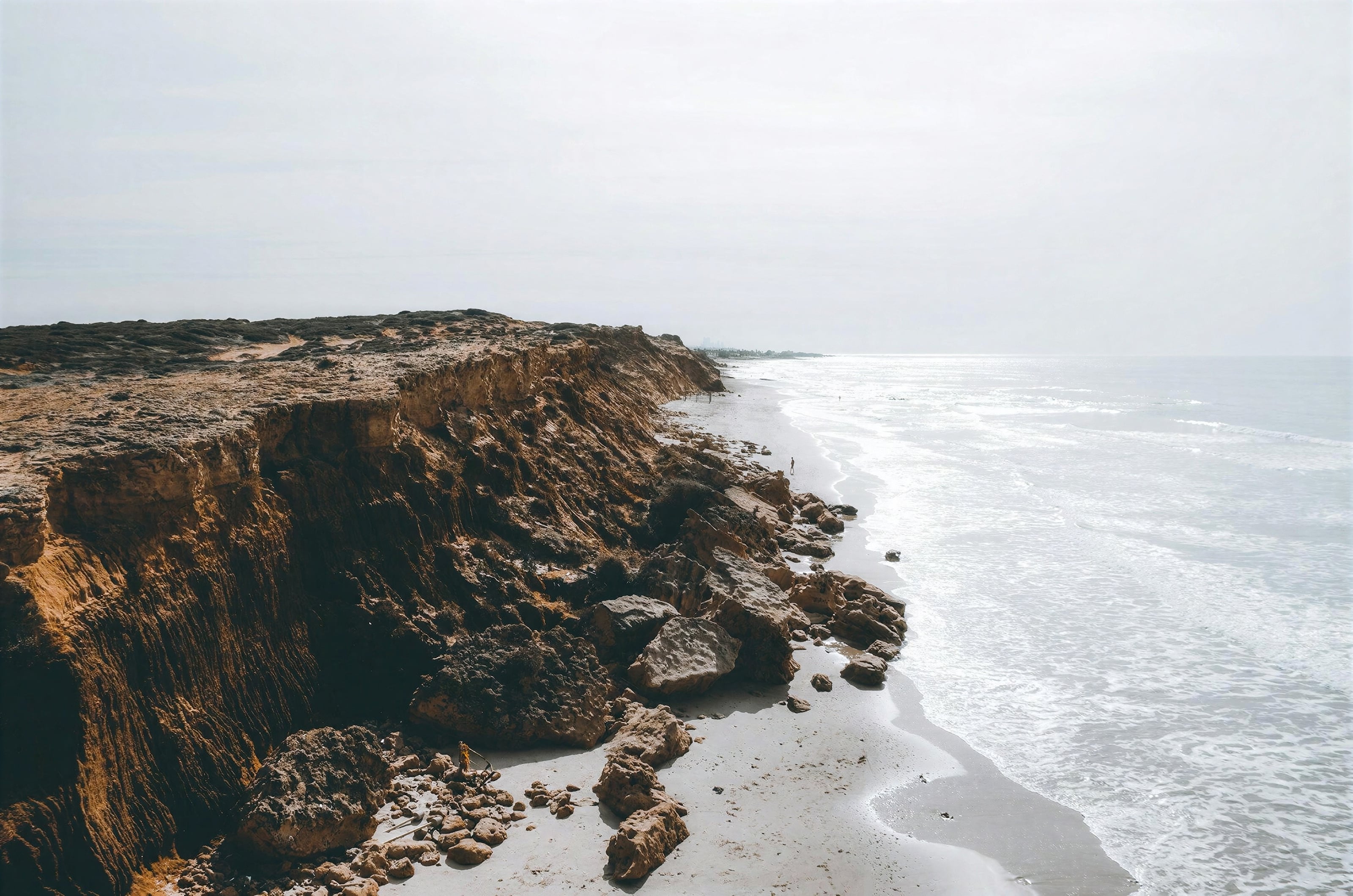 Cliffs and a sandy cove on the coast near Costa Vicentina